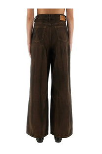 Dark brown wide-leg denim trousers with high waist and classic back pockets shown from the back by ganni women’s baggy pants brown