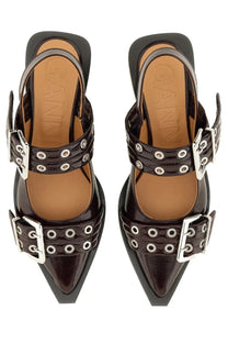 Black patent leather pointed-toe mules with silver-toned buckle straps and eyelets for women by Ganni