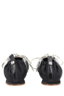 Ganni women’s ballerina sporty black leather flats with white printed ribbon laces and metallic logo on back view