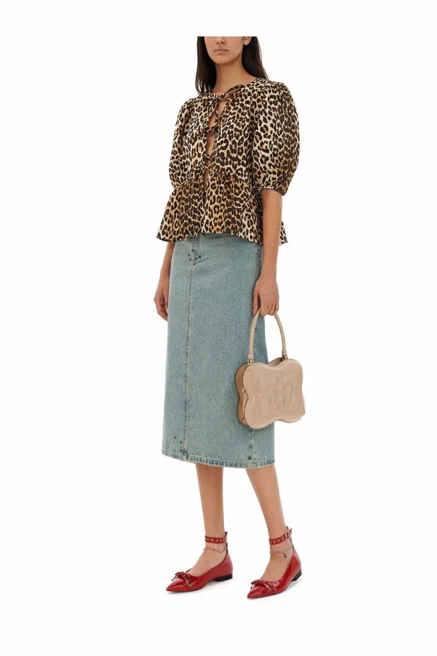 Beige bone-shaped handbag with subtle embossed logo and light leather handles featured in ganni women’s blouse pattern product line