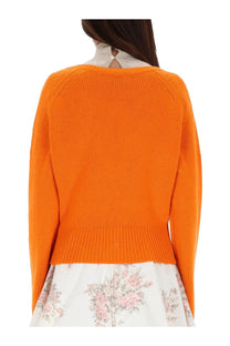Ganni women’s vibrant orange cashmere ribbed-knit sweater with raglan sleeves and fitted waistband