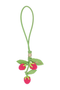 A vibrant pink crocheted strawberry charm with green leaf accents and lime-green leather strap by Gucci