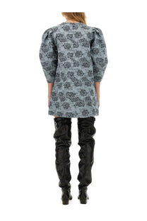 A light blue Ganni women’s floral jacquard mini dress with dark floral pattern and puffed sleeves