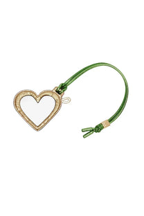 Ganni women’s heart mirror keychain with gold-toned textured frame and green cord attached in blue color