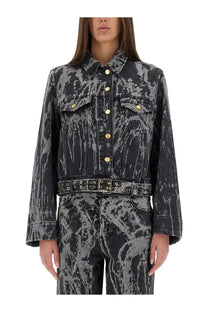 Ganni women’s heavy denim jacket in black with gray tie-dye and gold-tone buttons front view