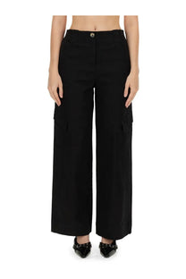 Ganni women’s black herringbone wide-leg cargo pants with side pockets and button closure visible from the front