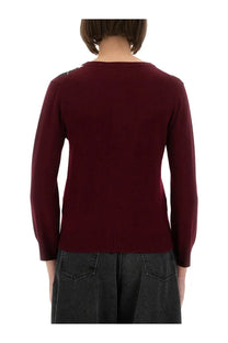 Burgundy knit sweater with long sleeves and round neckline featuring subtle shoulder details from ganni cashmere cardigan collection