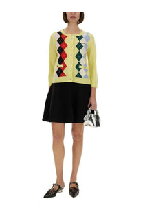Ganni women’s multicolor jacquard cashmere cardigan with vibrant yellow argyle knit featuring red black and light blue diamonds