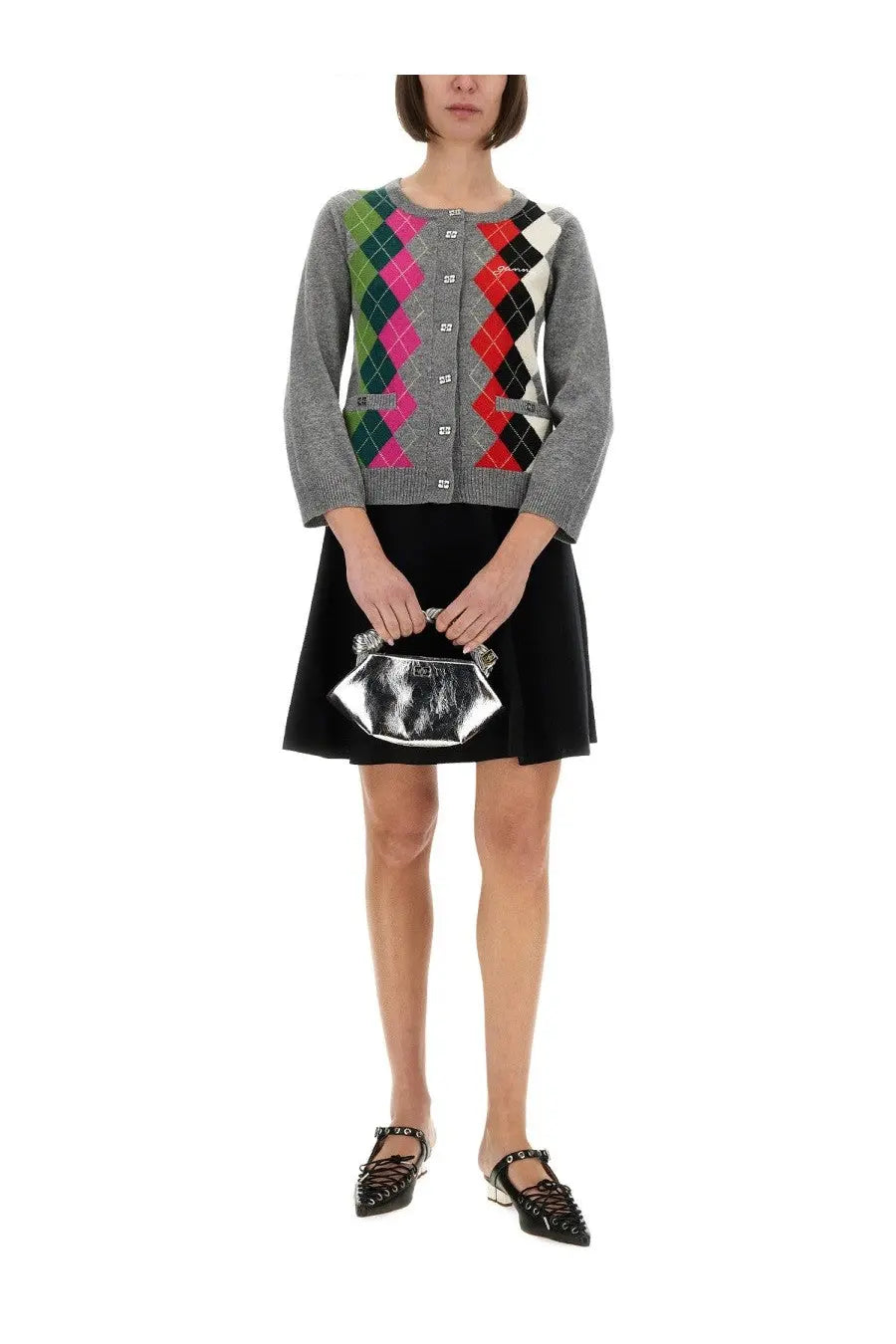 Silver metallic clutch with geometric angular design and embossed logo paired with ganni women’s purple jacquard cashmere cardigan