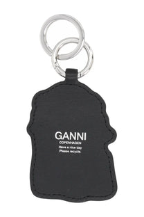 Ganni women’s black leather keychain with silver rings and white embossed text from Copenhagen please recycle design
