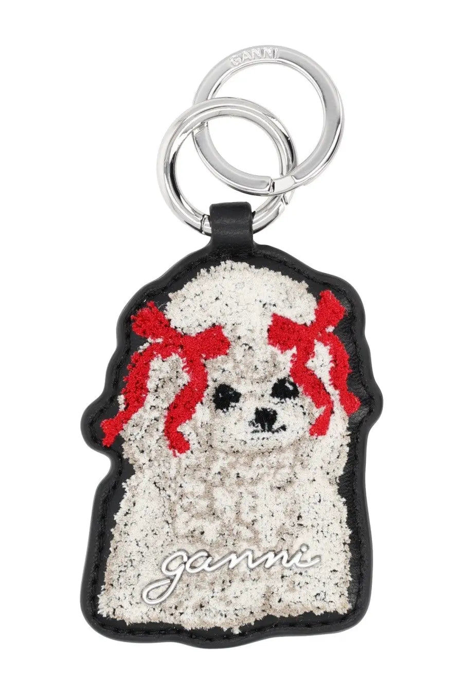 Ganni women’s leather keychain black featuring a white textured poodle shape with red ribbon and black leather border