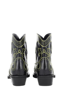 Ganni women’s low shaft black leather cowboy boots with neon yellow stitching and decorative patterns