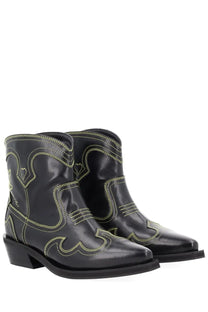 Ganni womens low shaft black leather cowboy boots with neon yellow stitching and heart shaped decorative patterns