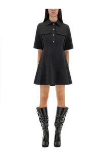 Ganni women’s mini dress in black with short sleeves button-up front two pockets and flared skirt