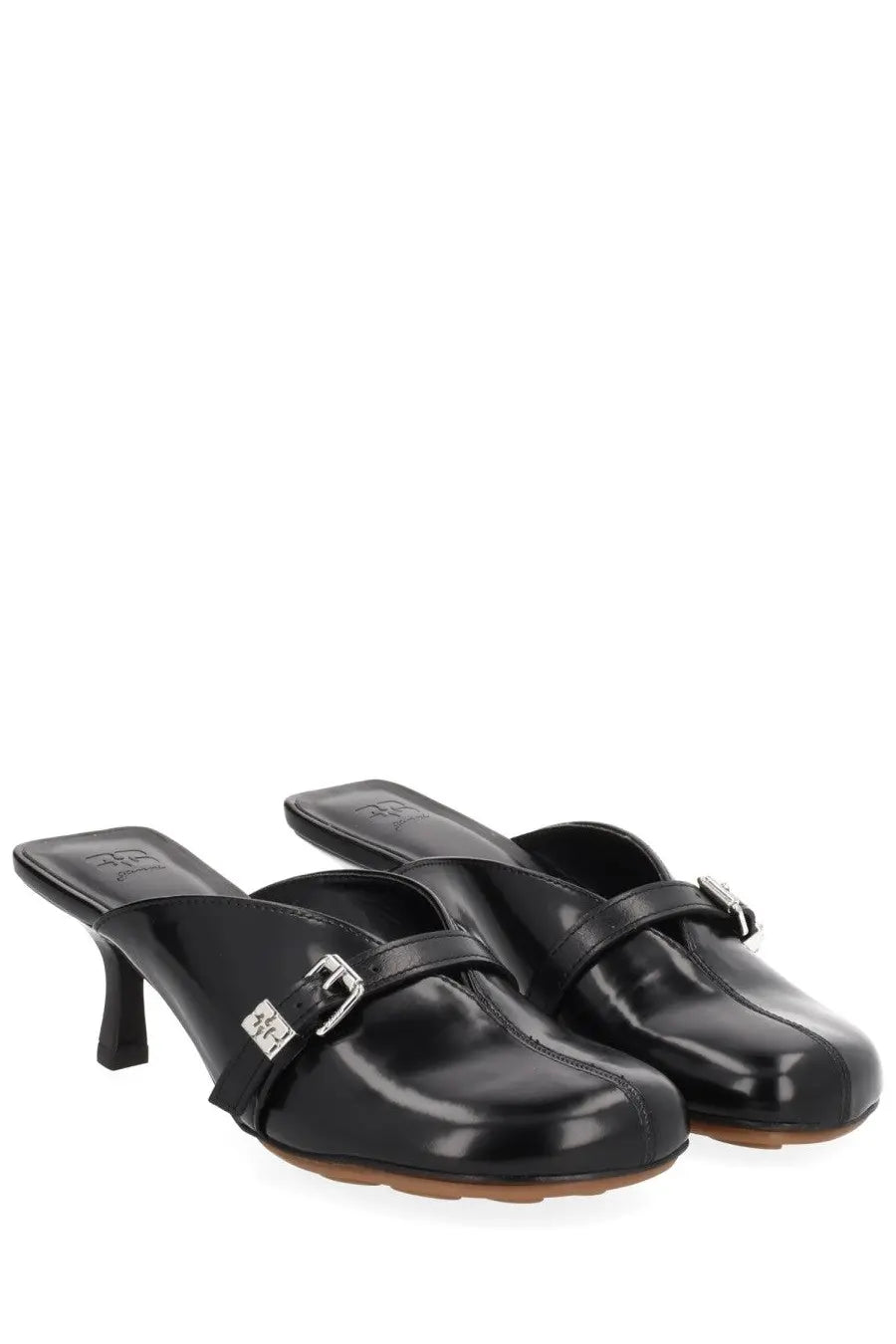 Ganni women’s black patent leather mules with silver buckle and low heel visible from the back side