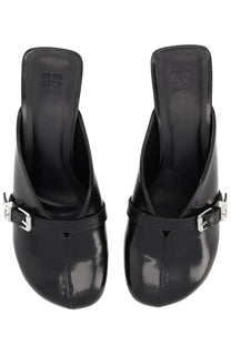 Ganni women’s mules black patent leather with silver-tone buckle straps front view