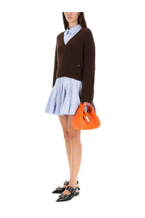 Vibrant orange leather hobo bag with a distinctive metallic clasp complementing Ganni women’s neck sweater brown