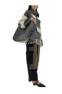 Black glossy leather shoulder bag with structured slouchy silhouette and top handle for everyday use