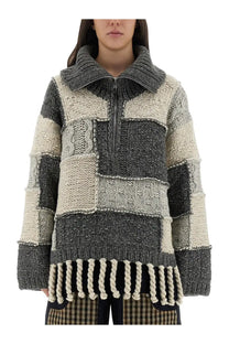Ganni women’s chunky patchwork knit sweater in gray and off-white with high collar zipper and rope tassels at hem