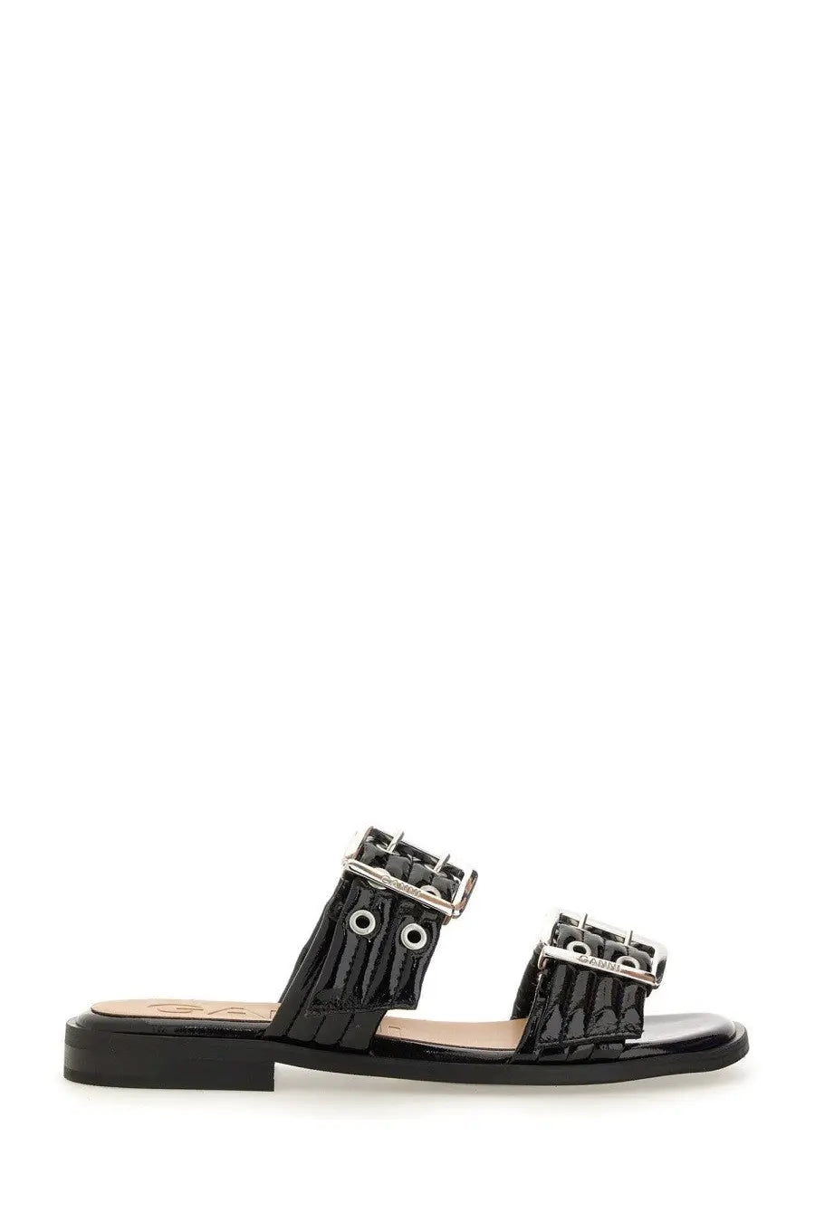 Ganni women’s black patent leather slide sandal with two silver buckle straps and a flat sole