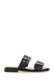 Ganni women’s black patent leather slide sandal with two silver buckle straps and a flat sole