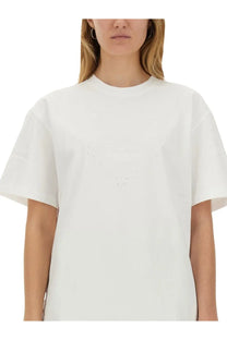 Ganni women’s white oversized shirt with subtle v-shaped dark dot embellishment across the chest