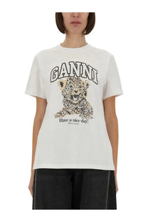 White ganni women’s shirt featuring a black and beige illustrated leopard cub graphic and have a nice day print