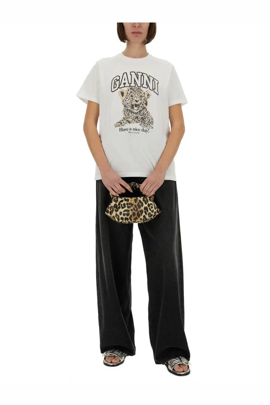 White ganni women’s shirt featuring a leopard graphic and have a nice day text on the front