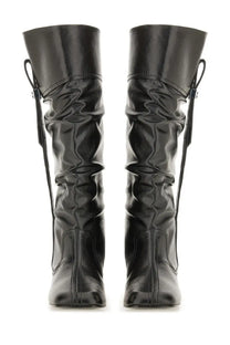 Ganni women’s slouchy knee-high boots in black glossy leather with ruched design and adjustable side laces