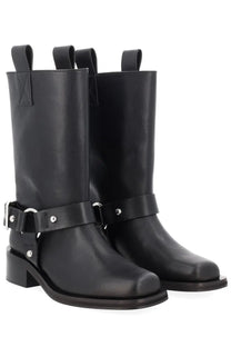 Ganni women’s stivale biker black leather boots with silver-toned buckles and studs in a front view