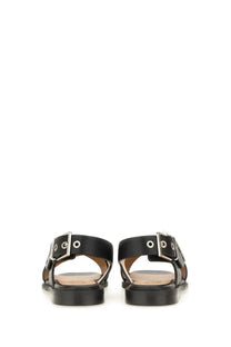 Ganni women’s black leather sandals with silver toned buckle details and studded accents front view
