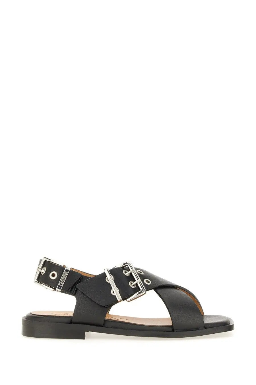 Black leather ganni women’s studded sandal with silver-toned buckle straps and flat sole front view