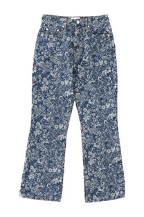 Ganni women’s tapestry jeans blue featuring delicate white and gray floral pattern on blue denim fabric