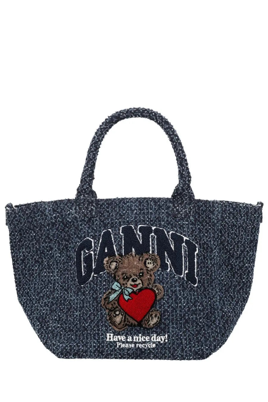 Dark blue textured tote bag featuring embroidered teddy bear holding red heart with ganni branding and recycle message