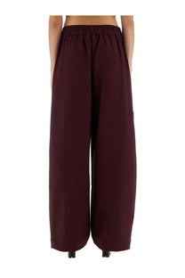 Burgundy twill wide-leg pants by ganni with elastic waistband and side pockets for comfortable casual wear