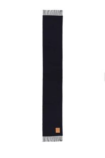 Ganni women’s wool scarf blue featuring sleek black wool with textured weave and white fringe with tan leather tag