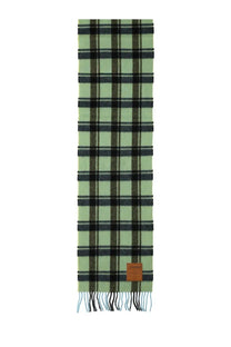 A light green and black plaid wool scarf with fringed edges and a brown leather tag by Ganni women