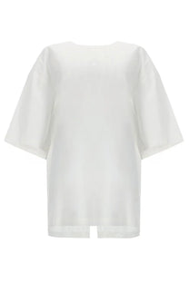 The Garment women’s blusa cyprus white minimalist blouse with loose three quarter sleeves and a subtle front slit