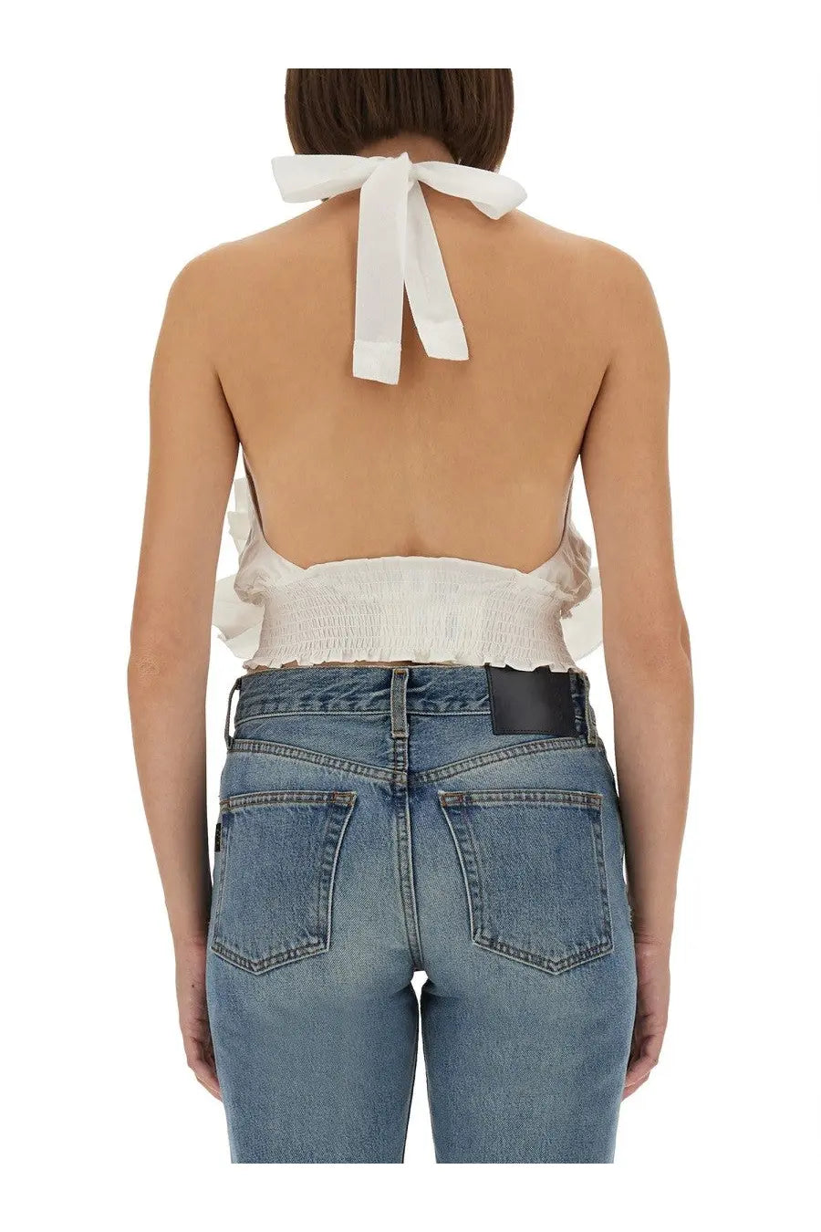 The Garment women’s Cyprus layer top white halter top with gathered smocked waistband and tied bow at the back view