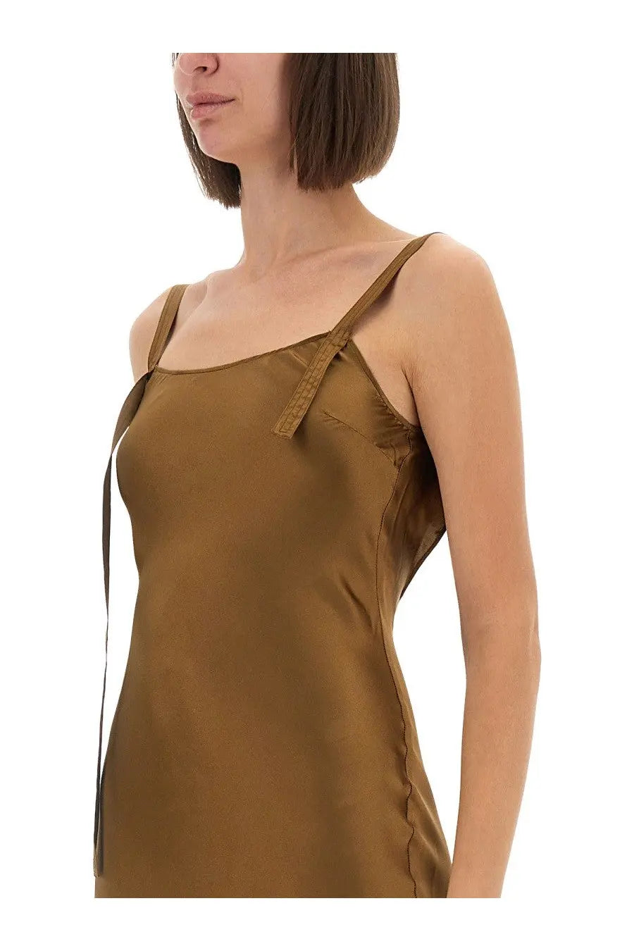 The garment women’s dress catania bronze is a sleek olive green satin slip dress with thin straps and textured shoulder detail