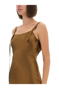 The garment women’s dress catania bronze is a sleek olive green satin slip dress with thin straps and textured shoulder detail