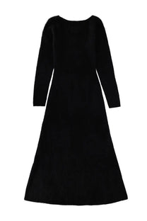 The garment women’s long dress roma black is a sleek black velvet midi dress with long sleeves and a flowing silhouette