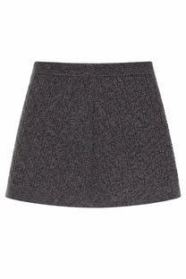 The Garment women’s miniskirt Como grey is a dark gray textured knit skirt with a subtle diamond pattern and ribbed waistband