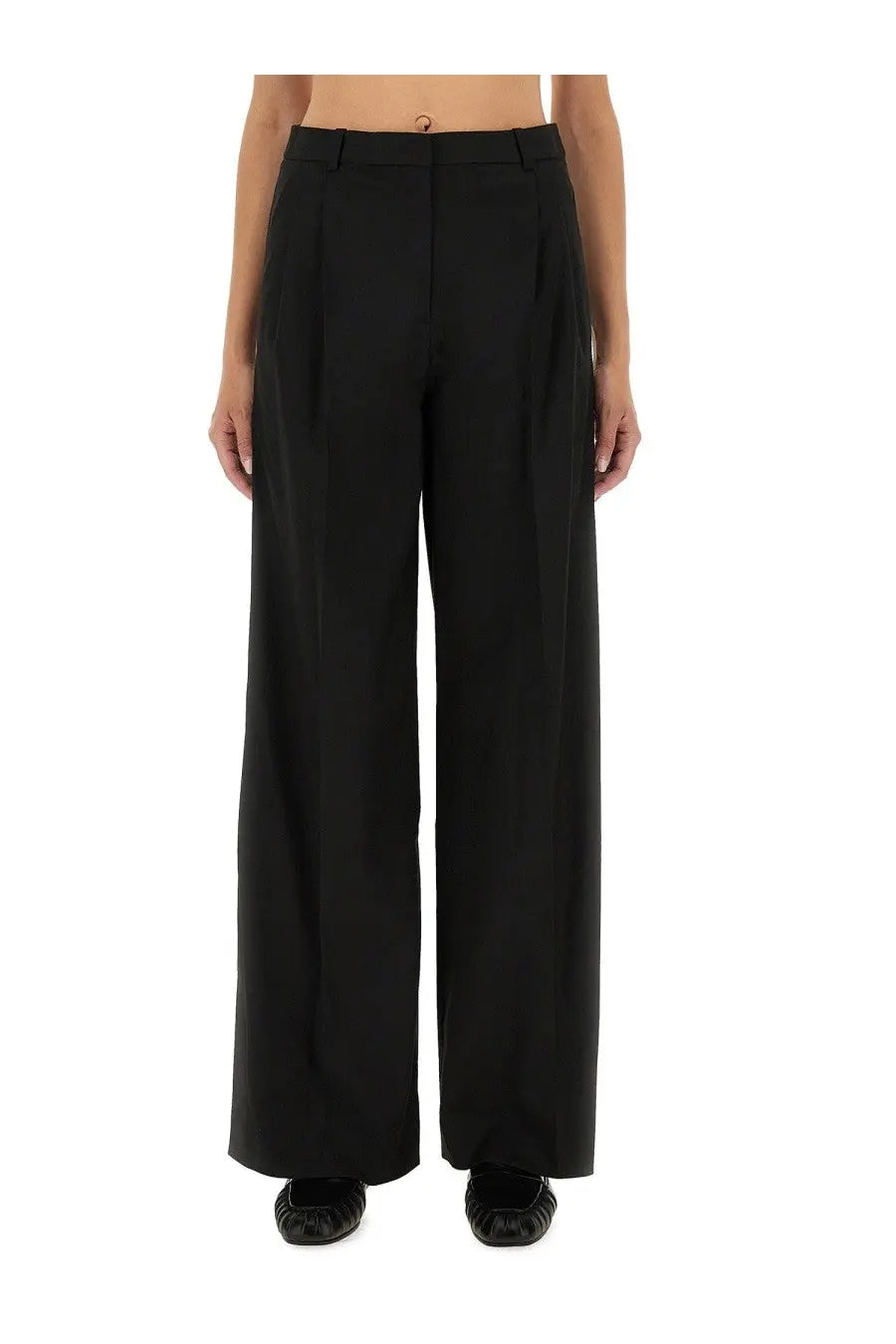 Black wide-leg tailored trousers with structured fit and subtle pleats at waistband from the garment women pants pluto black