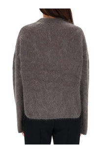 The garment women’s roma boyfriend sweater grey is a soft gray fuzzy knit with a relaxed fit and long sleeves