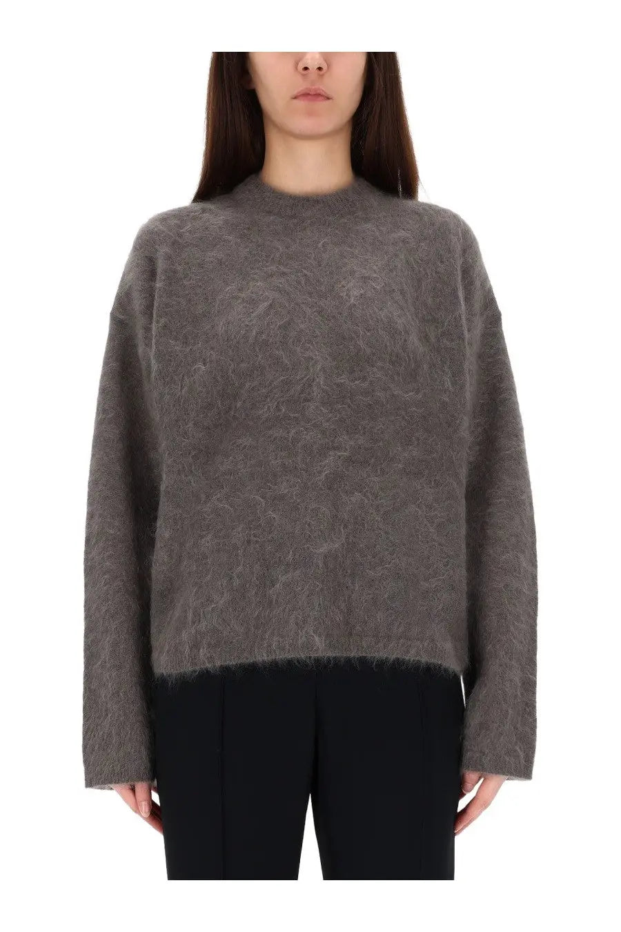 The garment women’s roma boyfriend sweater grey is a soft textured knit with a subtle pattern and frayed hem