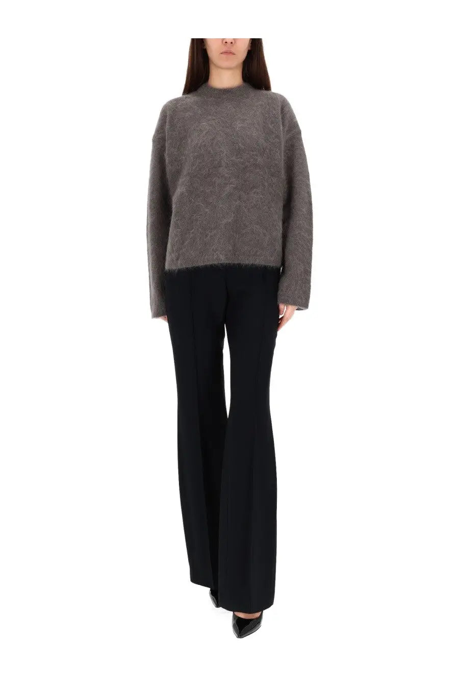 The garment women’s roma boyfriend sweater grey is a soft grey textured knit sweater with a subtle pattern and relaxed fit