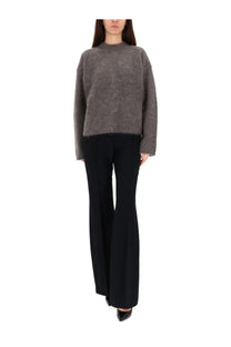 The garment women’s roma boyfriend sweater grey is a soft grey textured knit sweater with a subtle pattern and relaxed fit