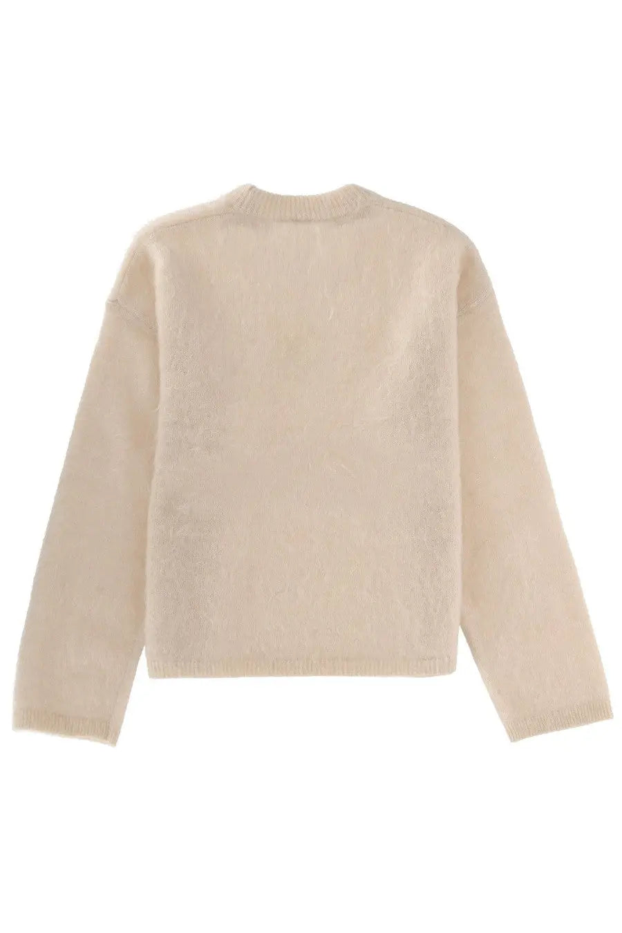 The garment women’s roma boyfriend sweater in cream features a soft knit texture with a crew neck and long sleeves
