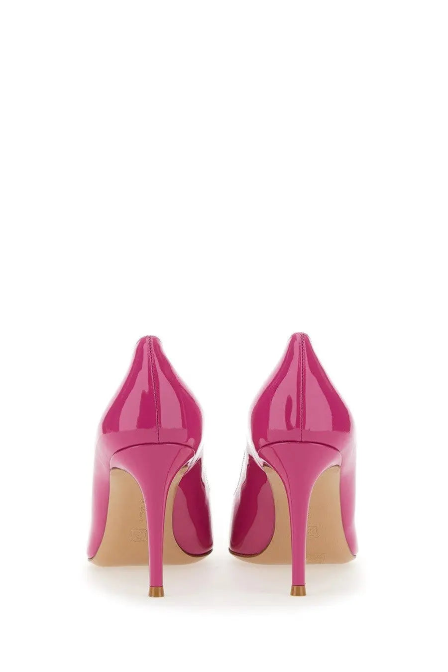 Vibrant fuchsia patent leather high-heeled pumps with pointed toe and gold-tipped stiletto heels by Gianvito Rossi